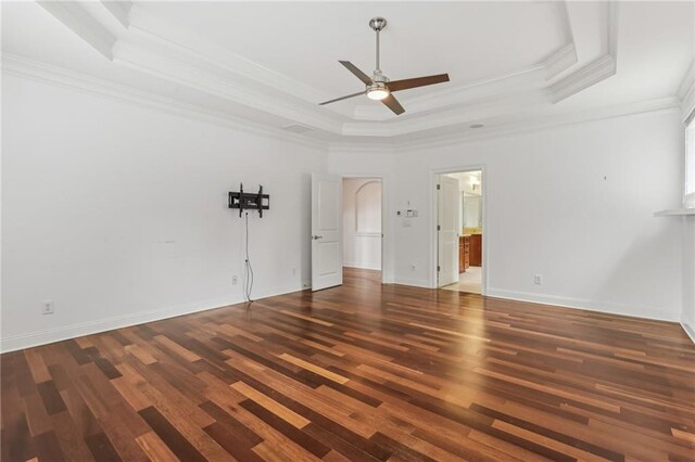4540 Hastings Dr, Cumming, GA 30041 - unfurnished bedroom with a raised ceiling, ornamental molding, wood finished floors, baseboards, and connected bathroom