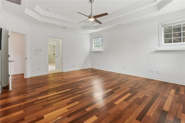 4540 Hastings Dr, Cumming, GA 30041 - spare room featuring a raised ceiling, ornamental molding, ceiling fan, wood finished floors, and baseboards