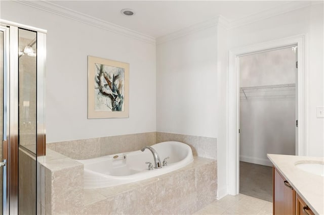 bathroom with vanity, ornamental molding, tile patterned flooring, a spacious closet, and a bath