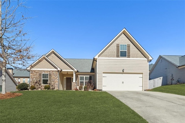 craftsman-style house with an attached garage, driveway, a front yard, and fence