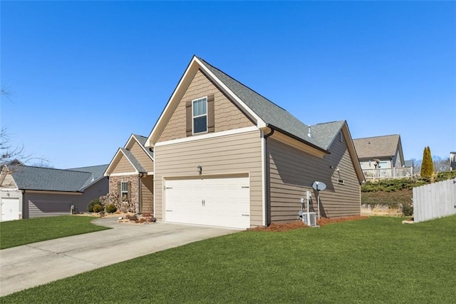 view of front facade featuring a garage, fence, driveway, and a front lawn