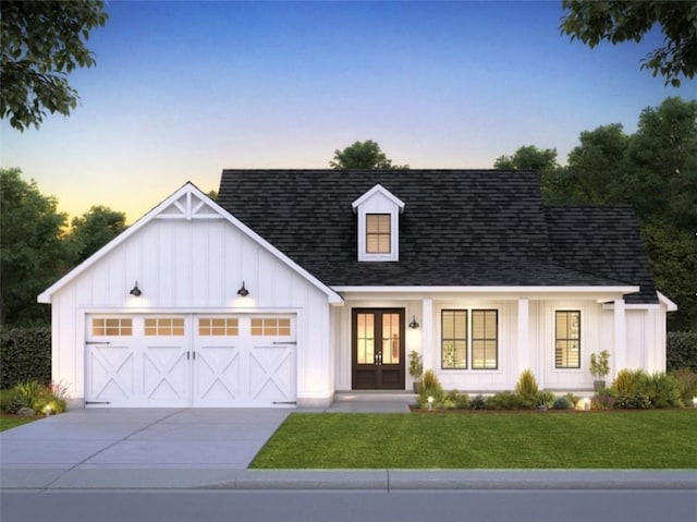 0 Utah Dr, Elberton, GA 30635 - modern farmhouse with french doors, an attached garage, board and batten siding, a yard, and concrete driveway