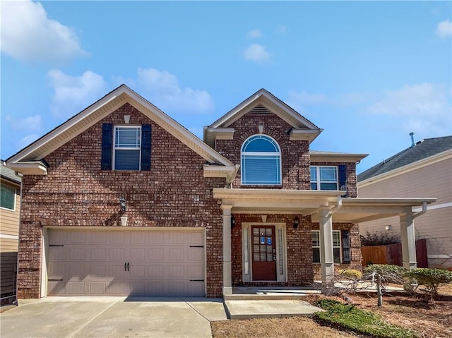 traditional home featuring brick siding and driveway