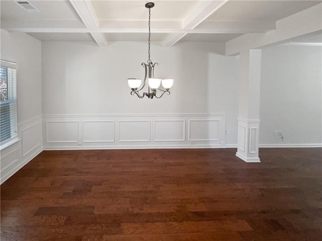 empty room with visible vents, beam ceiling, a notable chandelier, and dark wood-style floors