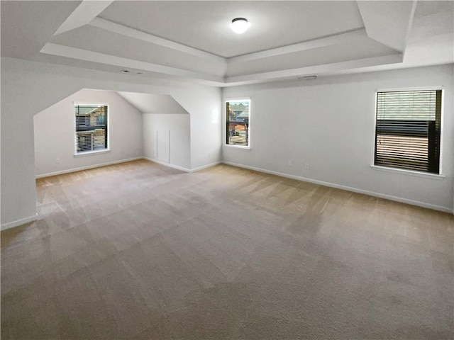 bonus room featuring carpet flooring and baseboards