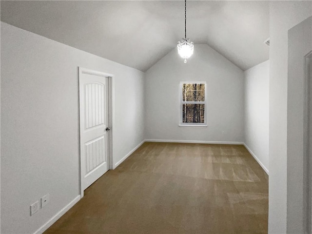 bonus room with baseboards, carpet flooring, and vaulted ceiling