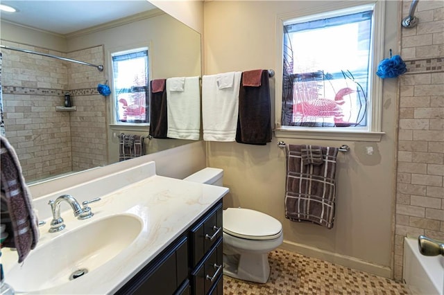 full bathroom featuring vanity, tile patterned floors, tiled shower / bath, toilet, and ornamental molding