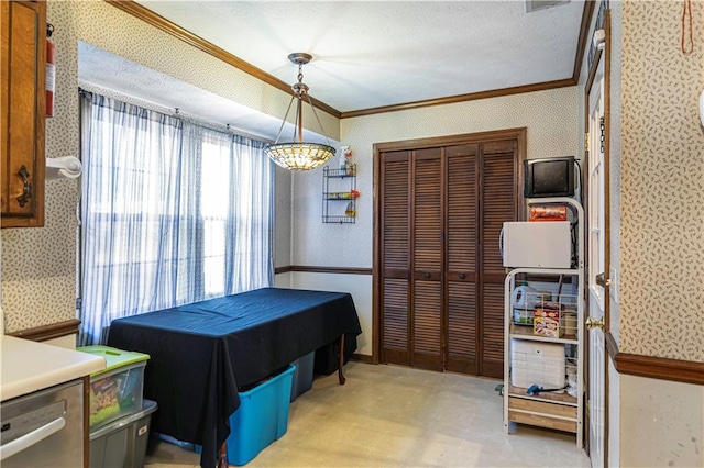 dining space with a notable chandelier and crown molding