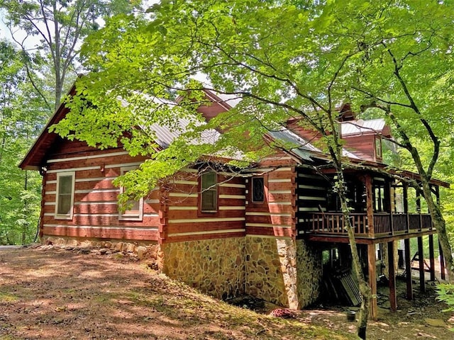 view of side of property with log siding