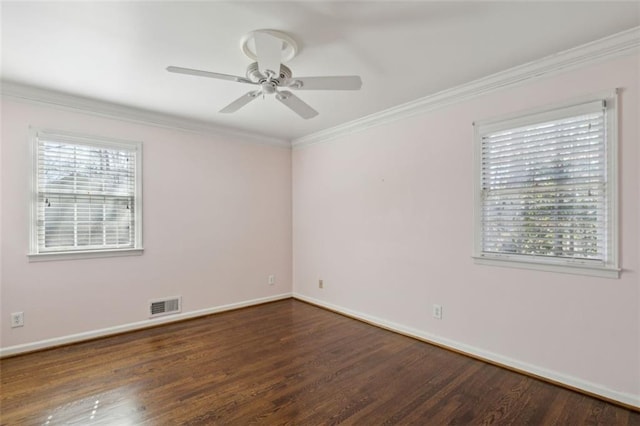 spare room with dark hardwood / wood-style flooring, crown molding, and ceiling fan