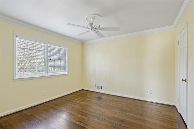 spare room with crown molding, ceiling fan, and dark hardwood / wood-style floors