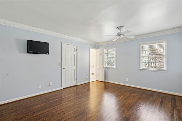 empty room with crown molding, dark hardwood / wood-style floors, and ceiling fan