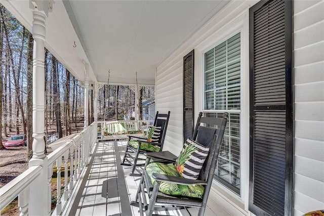 wooden terrace featuring a porch