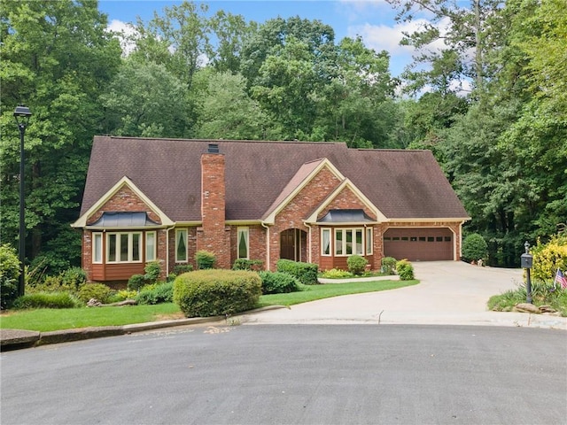3436 Laurelwood Ct NE, Roswell, GA 30075 - view of front of property with a garage, a chimney, concrete driveway, and brick siding
