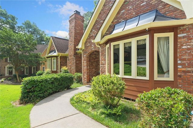3436 Laurelwood Ct NE, Roswell, GA 30075 - view of front of home with a chimney and brick siding