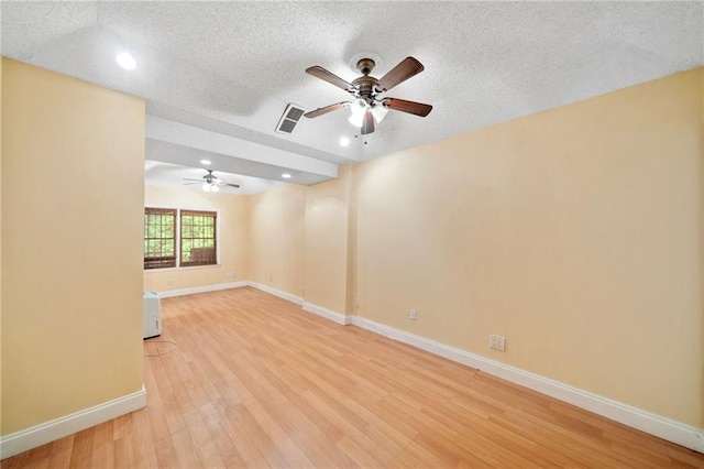 3436 Laurelwood Ct NE, Roswell, GA 30075 - spare room featuring a ceiling fan, light wood-style flooring, a textured ceiling, and recessed lighting