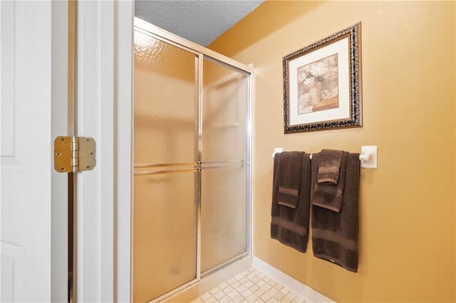 3436 Laurelwood Ct NE, Roswell, GA 30075 - bathroom featuring a shower stall and a textured ceiling