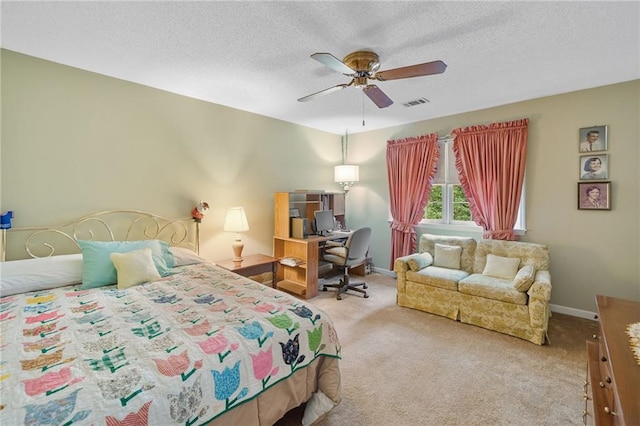 3436 Laurelwood Ct NE, Roswell, GA 30075 - carpeted bedroom with a textured ceiling, a ceiling fan, and an office area
