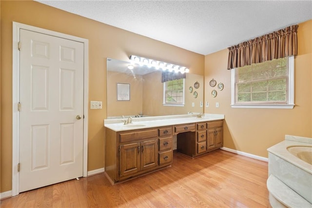 3436 Laurelwood Ct NE, Roswell, GA 30075 - bathroom with double vanity and wood finished floors
