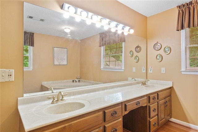 3436 Laurelwood Ct NE, Roswell, GA 30075 - full bathroom featuring double vanity, wood finished floors, and a garden tub