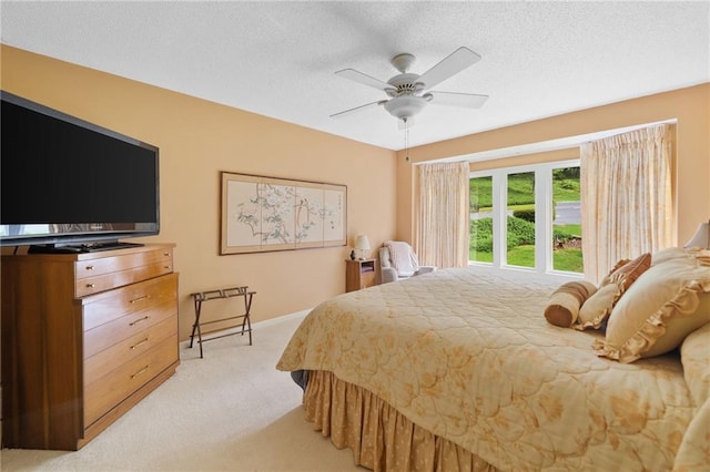 3436 Laurelwood Ct NE, Roswell, GA 30075 - bedroom with light carpet, a textured ceiling, and ceiling fan