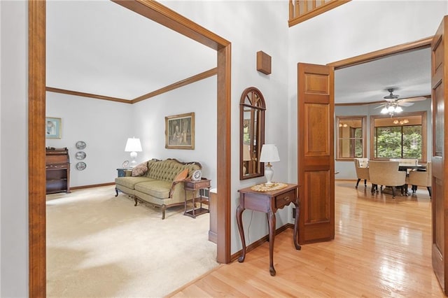 3436 Laurelwood Ct NE, Roswell, GA 30075 - entrance foyer featuring ornamental molding, light wood-style flooring, and a ceiling fan
