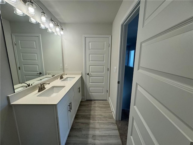 bathroom featuring hardwood / wood-style floors and vanity