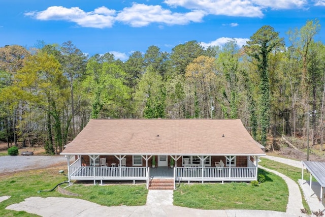 country-style home featuring a front yard and a porch