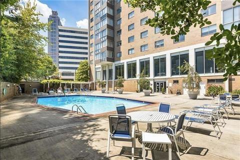 community pool with a patio area