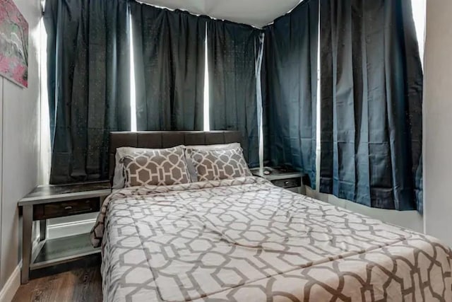 bedroom with wood finished floors