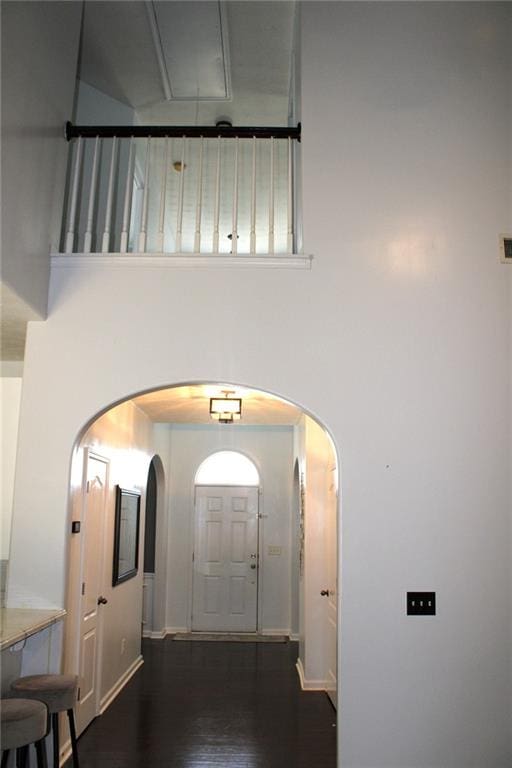 corridor with dark hardwood / wood-style flooring