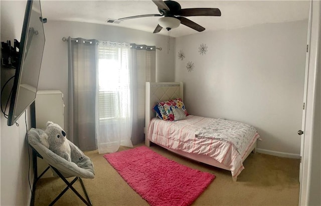 bedroom with ceiling fan and carpet floors