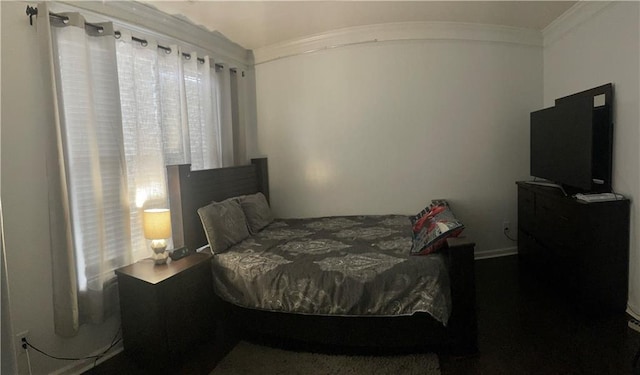 bedroom featuring crown molding