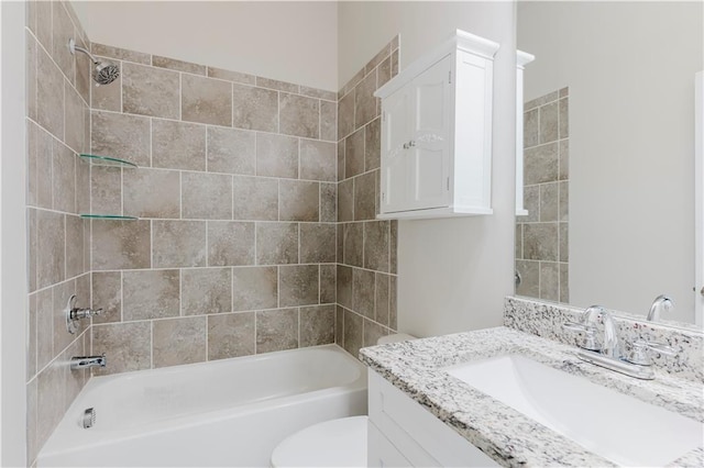 full bath featuring toilet, vanity, and shower / tub combination
