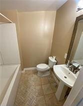 615 Woodruff Rd, Carrollton, GA 30116 - full bathroom featuring baseboards and toilet