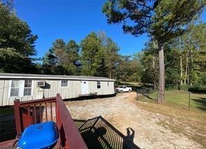 615 Woodruff Rd, Carrollton, GA 30116 - exterior space with a wooden deck