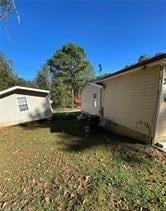 615 Woodruff Rd, Carrollton, GA 30116 - view of side of property featuring a lawn