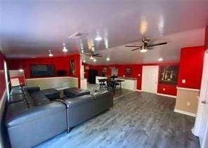 615 Woodruff Rd, Carrollton, GA 30116 - living area featuring ceiling fan, wood finished floors, and baseboards