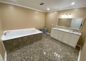 615 Woodruff Rd, Carrollton, GA 30116 - full bath featuring crown molding, double vanity, visible vents, baseboards, and a garden tub