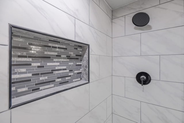 bathroom view of tiled shower