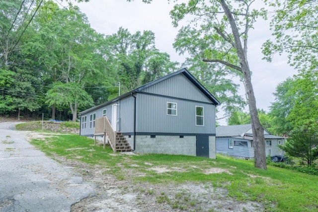 view of side of property with stairs