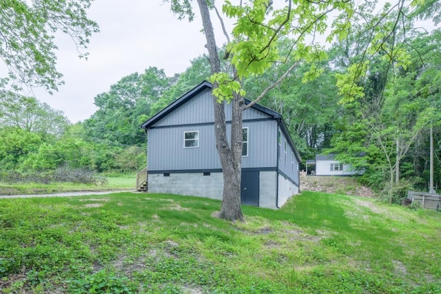 view of home's exterior with a yard