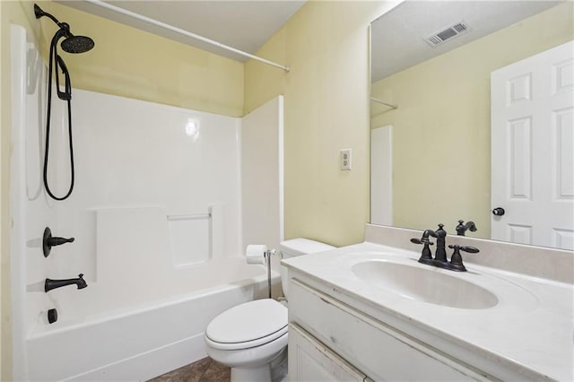 full bathroom featuring toilet, vanity, washtub / shower combination, and visible vents
