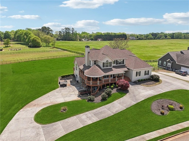 birds eye view of property featuring a rural view
