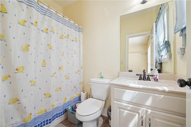 bathroom with toilet, curtained shower, and vanity