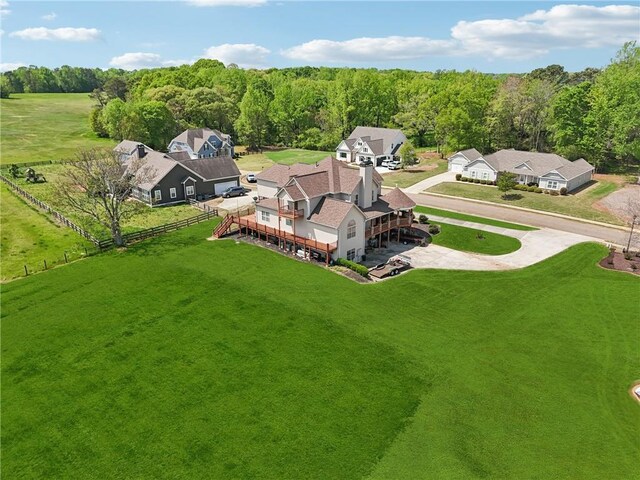 aerial view featuring a wooded view