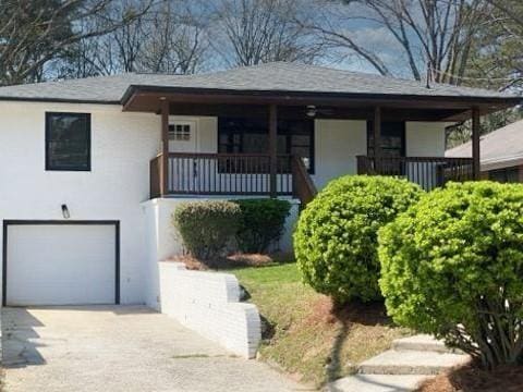 view of front facade with a garage and covered porch