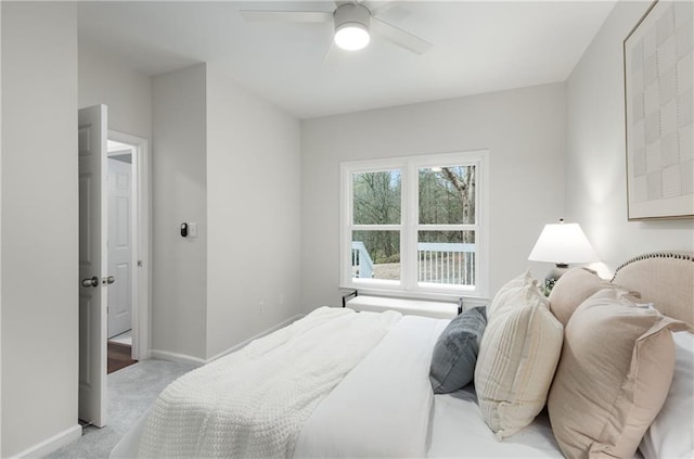 bedroom featuring a ceiling fan, carpet flooring, and baseboards