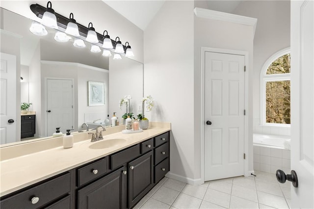 bathroom featuring lofted ceiling, a garden tub, tile patterned flooring, crown molding, and vanity