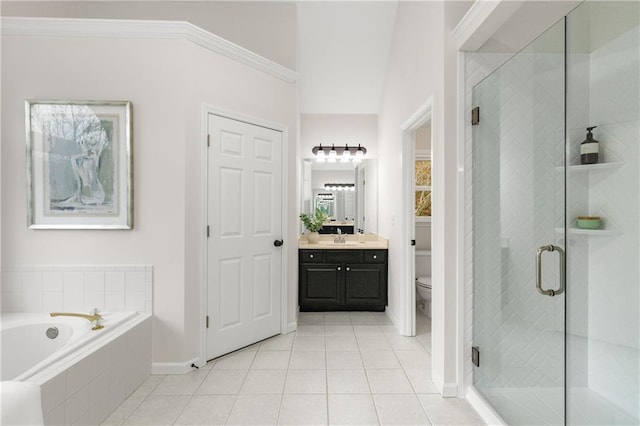 bathroom featuring a shower stall, vanity, a bath, and tile patterned floors